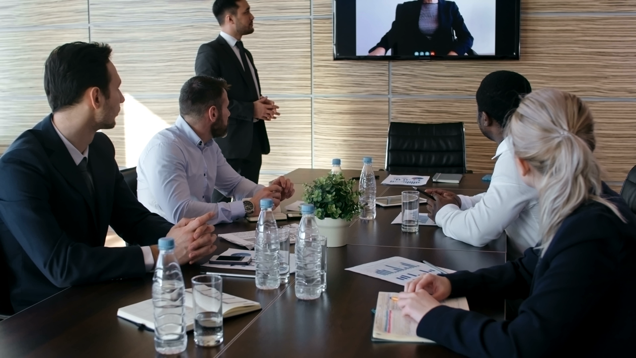 Group of people in a Videoconference Room